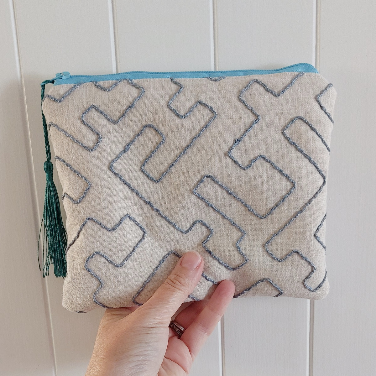 Blue embroidered make up bag