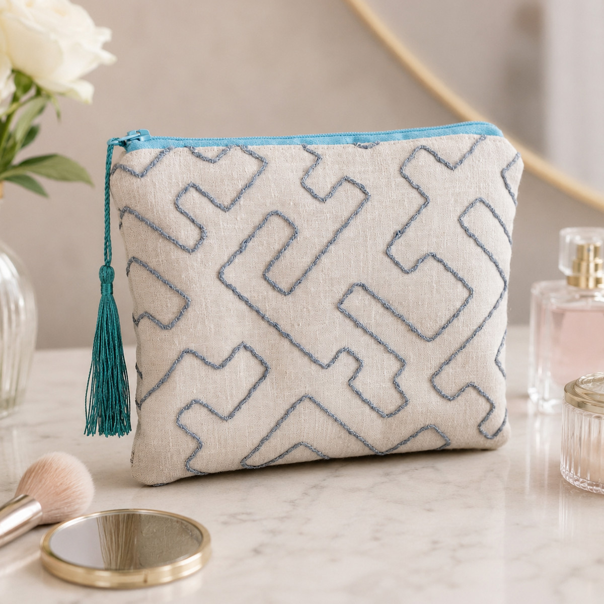 Blue embroidered make up bag