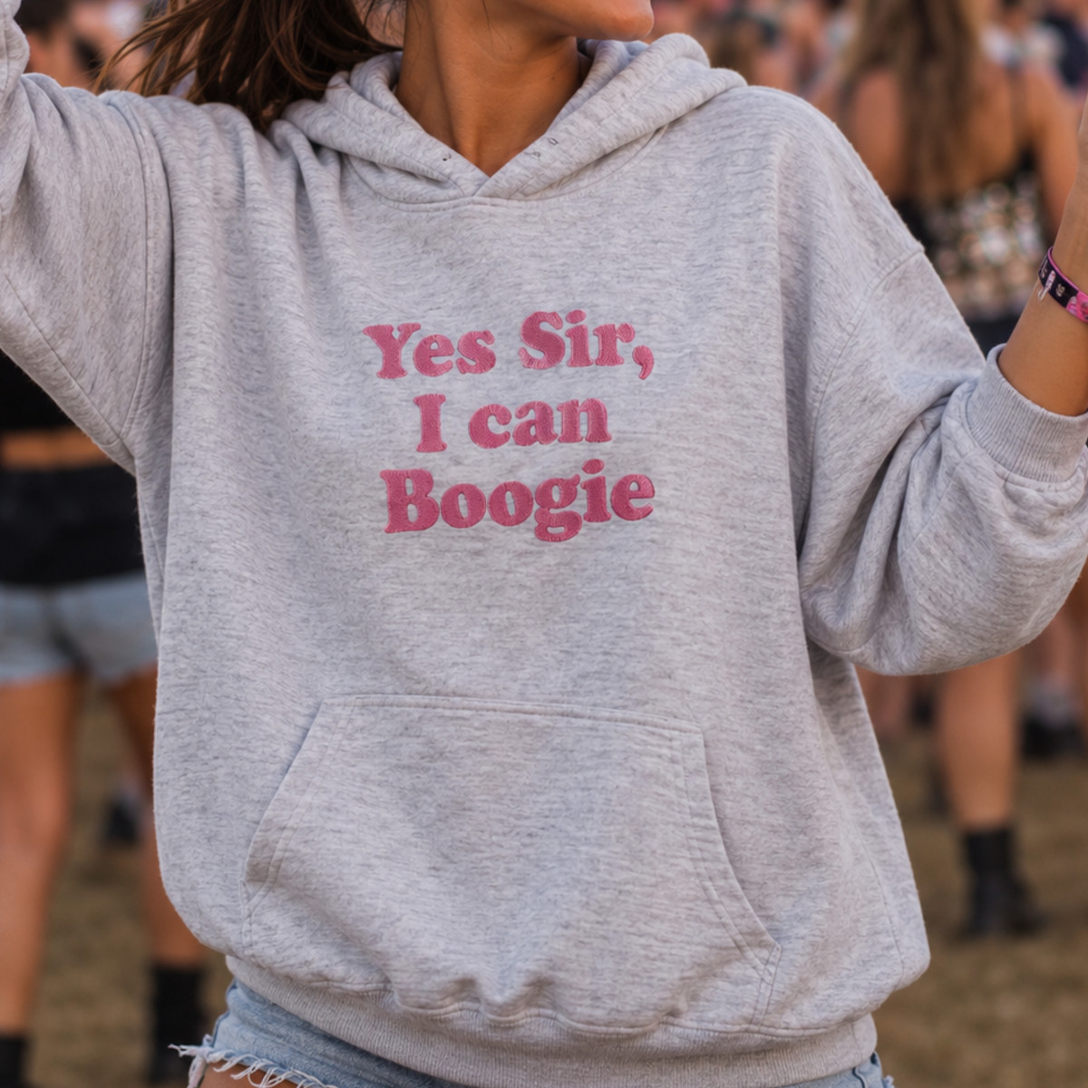 Model wears grey hoodie with Yes Sir, I can boogie on the front
